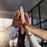 group high-fiving