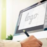 man designing a logo online