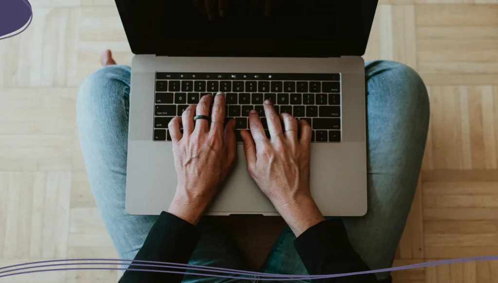 Woman using a laptop while working at home during the coronavirus outbreak.