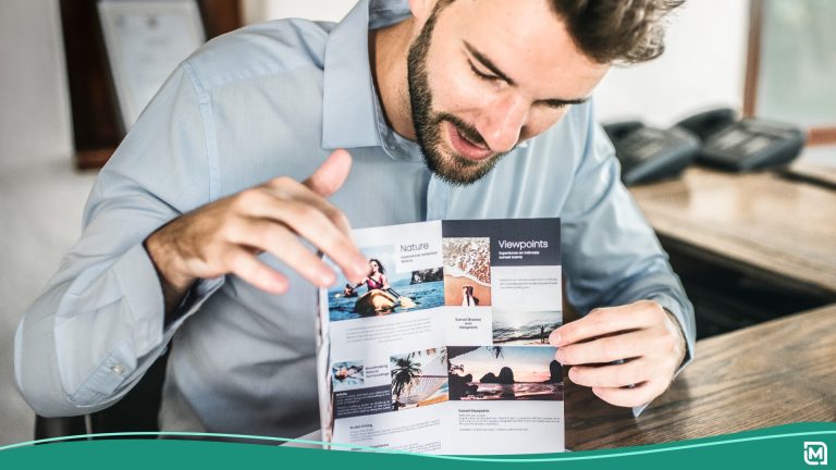 Man pointing to a colorful brochure