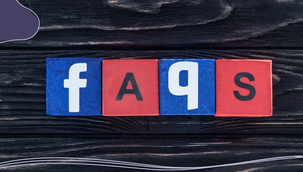 Top view of word faqs made of wooden blocks on dark wooden tabletop.