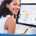 Woman designing a logo on a computer