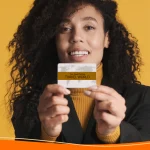 Woman holding up a business card