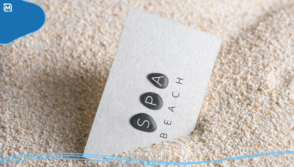 Business card for a spa buried in the sand