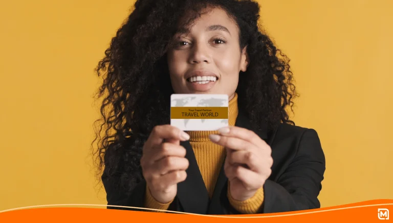 Woman holding up a business card