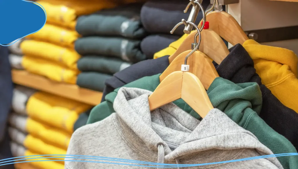 Hoodies of different colors hand on a hanger