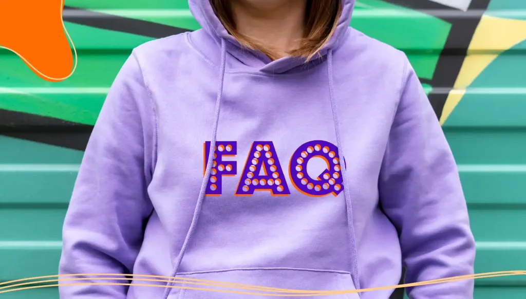 Woman wearing a purple hoodie with the letters FAQ printed on it