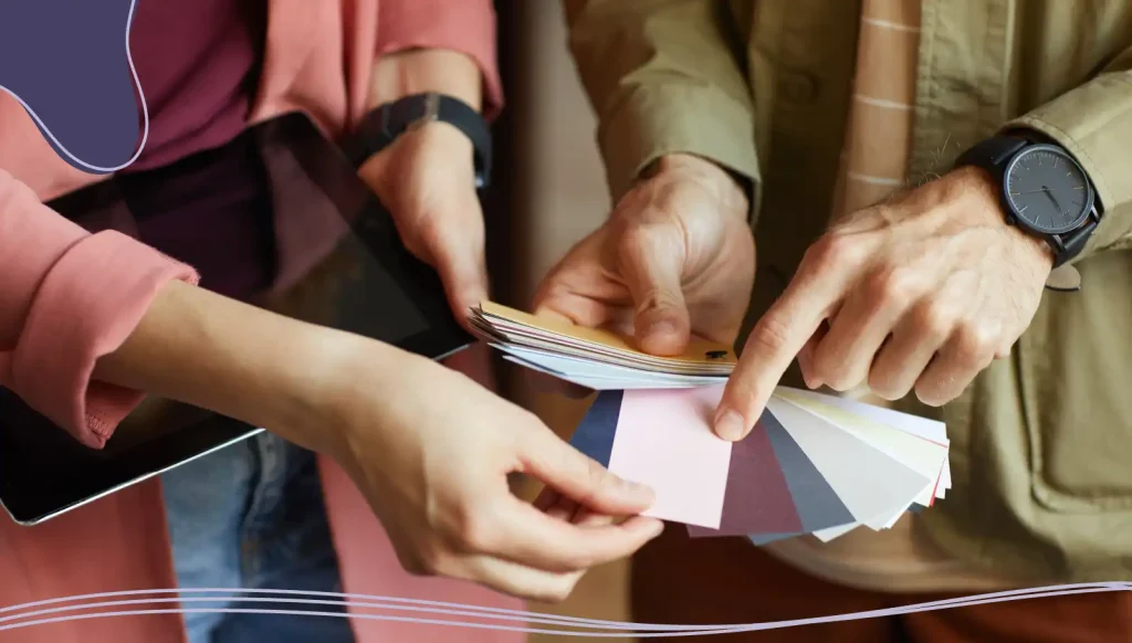 Two people picking colors for business cards