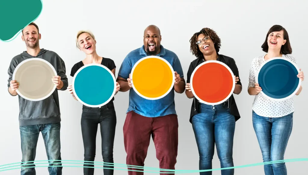 Diverse people holding blank round board.