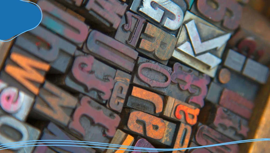 High angle close up of a selection of wood print keys in a variety of fonts